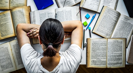 Asleep reading books in library