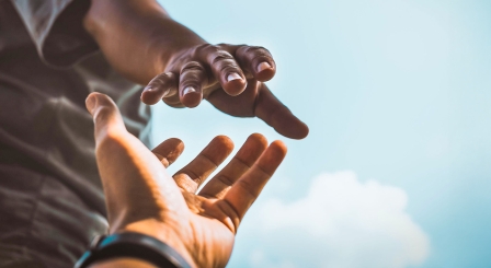Hand reaching out to help