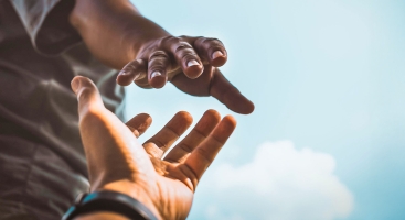 Hand reaching out to help