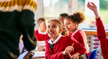 Child excited talking to teacher